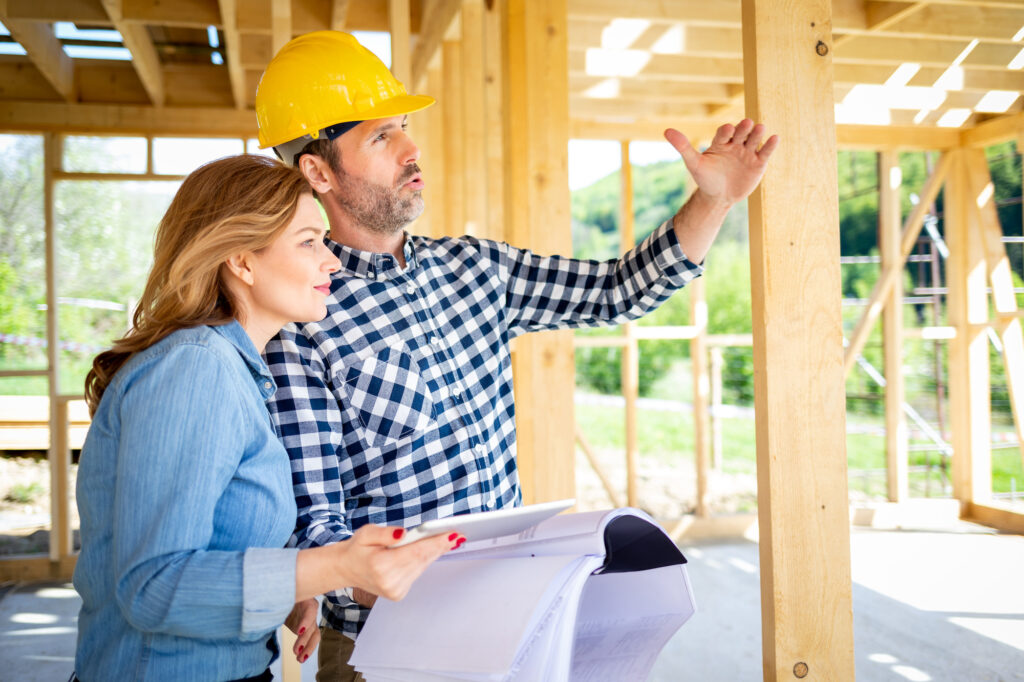 Contractor talks to a client about a real estate project.